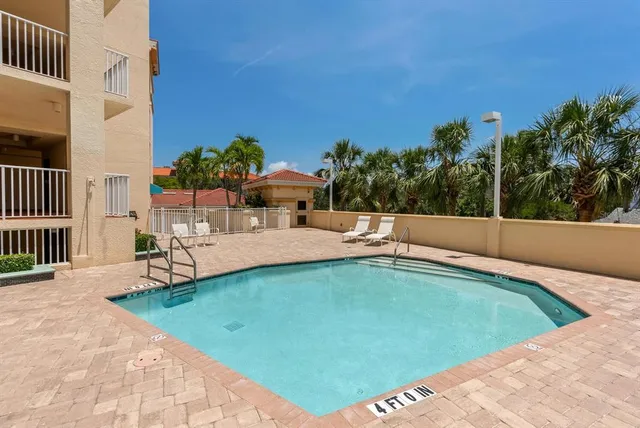 a view of a tall building with a palm tree