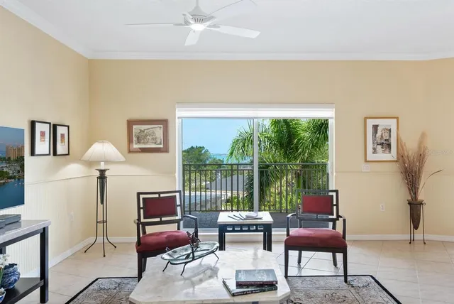 a living room with furniture lamp and a large window