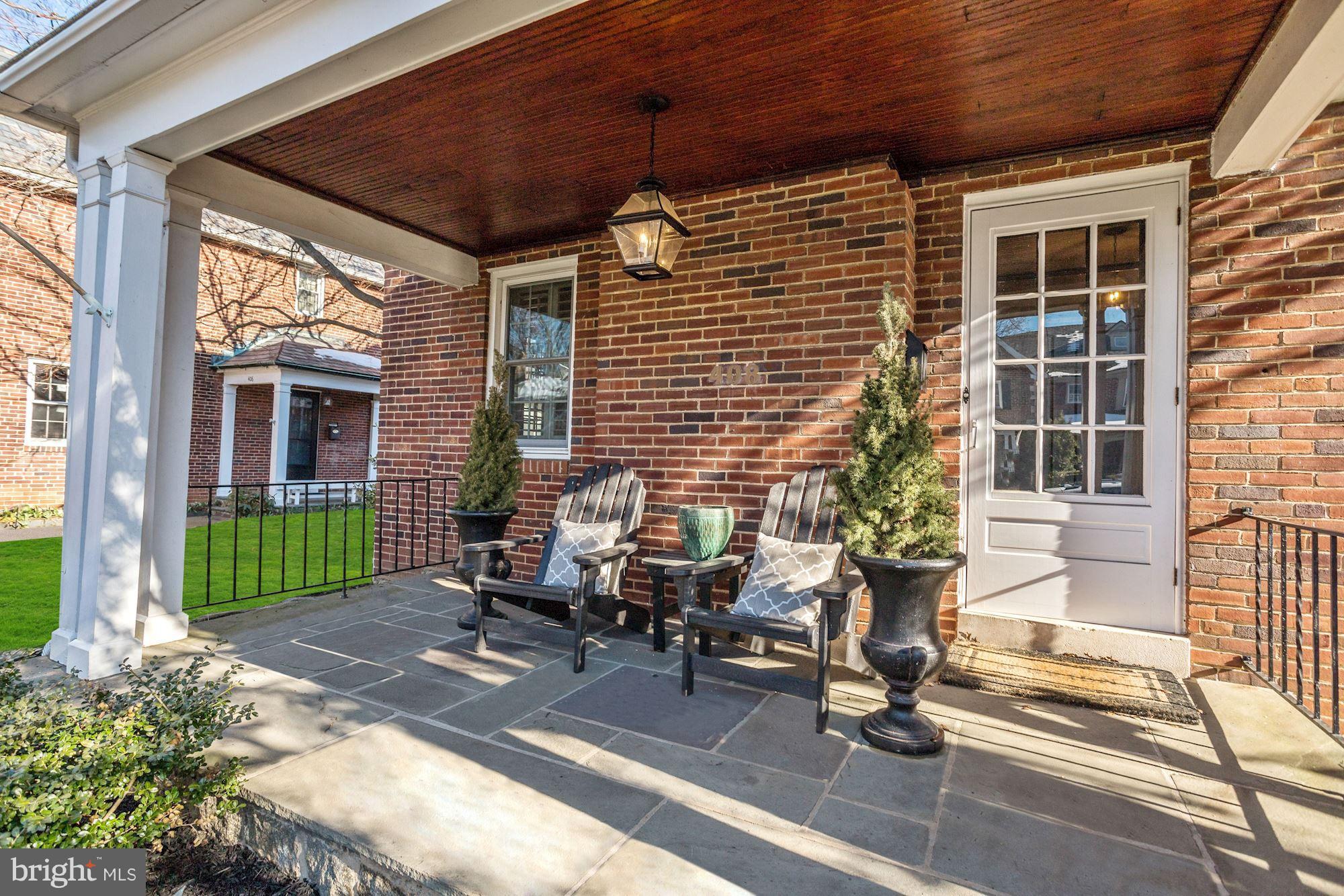 408 Dunkirk Road Baltimore, MD 21212 - Photo 2 of 22 a building outdoor space with patio furniture and potted plants