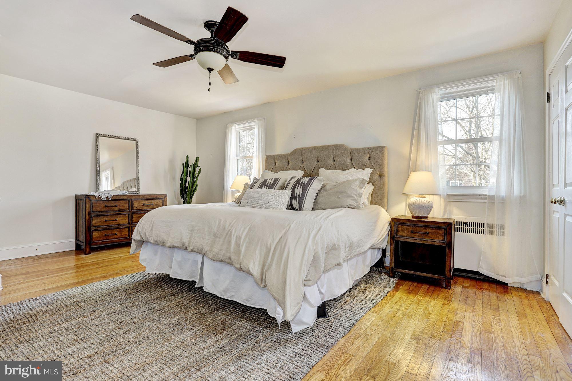 408 Dunkirk Road Baltimore, MD 21212 - Photo 11 of 22 a spacious bedroom with a bed and a table