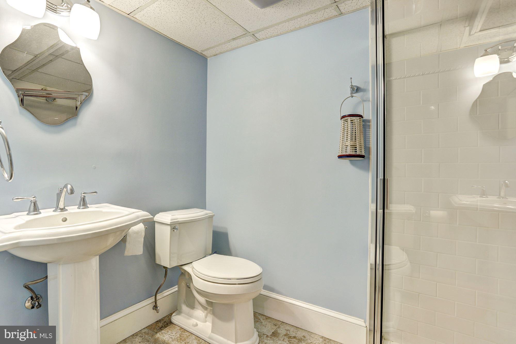 408 Dunkirk Road Baltimore, MD 21212 - Photo 20 of 22 a white toilet sitting next to a bathroom sink
