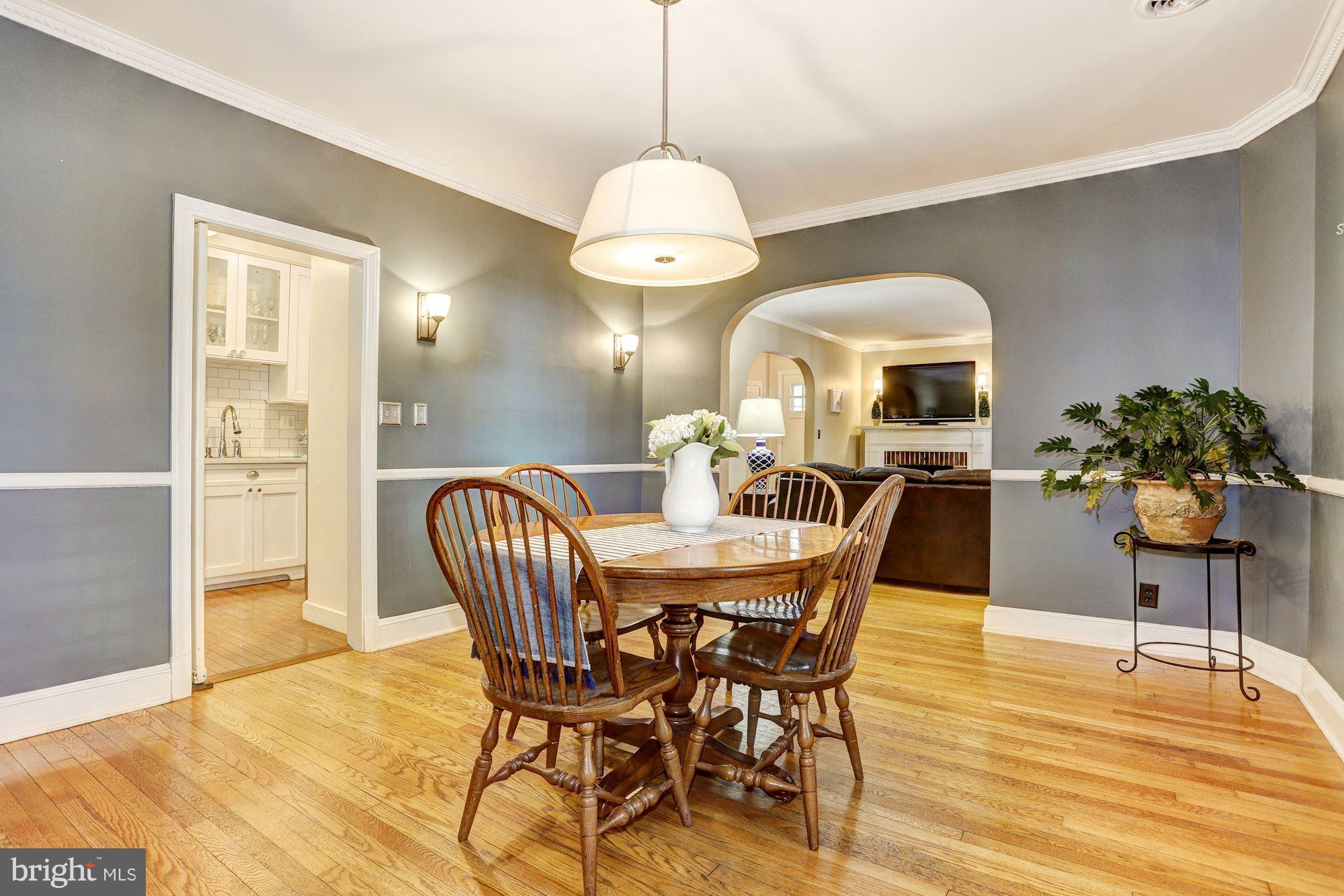 408 Dunkirk Road Baltimore, MD 21212 - Photo 8 of 22 a dining room with furniture potted plants and wooden floor