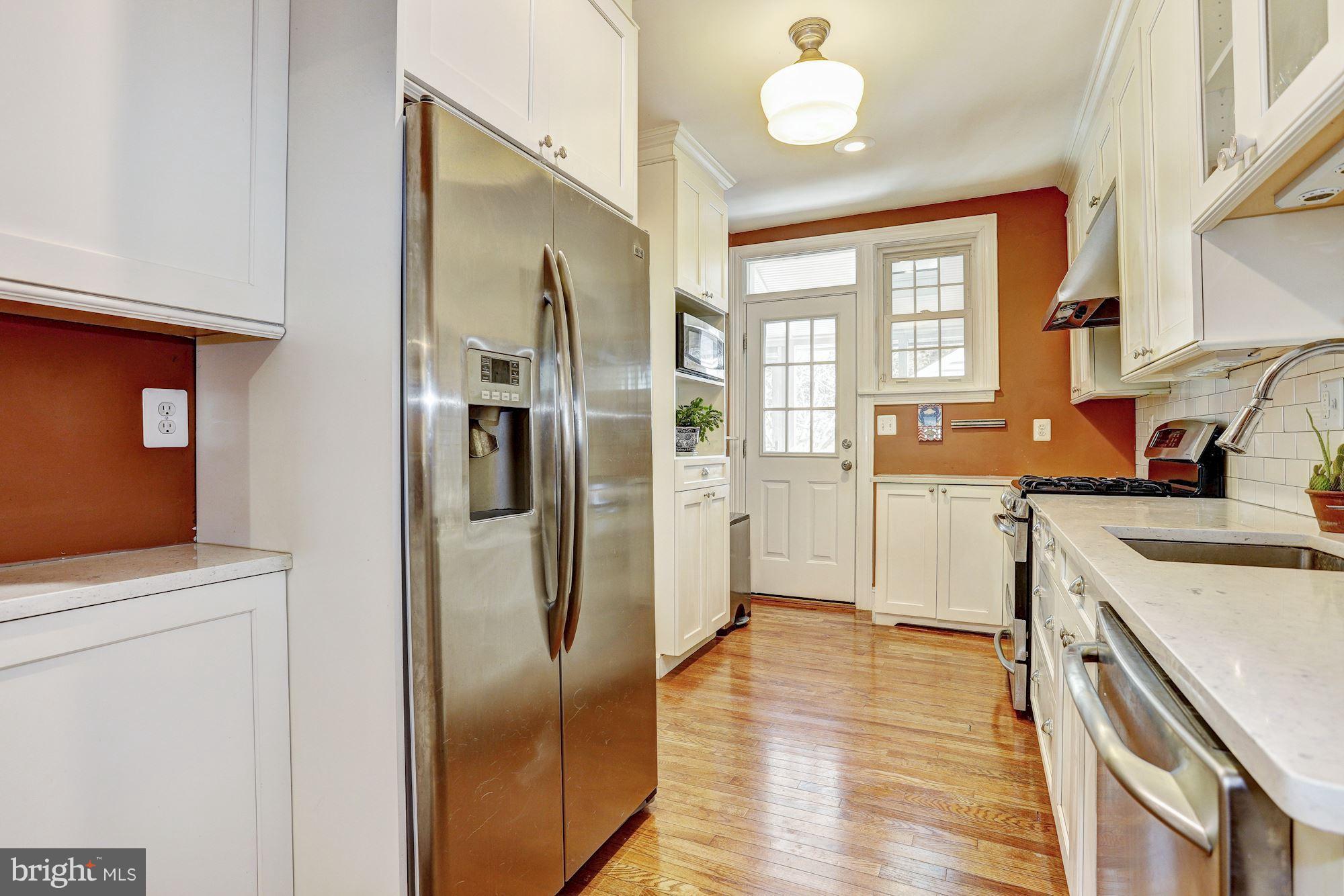 408 Dunkirk Road Baltimore, MD 21212 - Photo 9 of 22 a kitchen with stainless steel appliances granite countertop a refrigerator and a stove