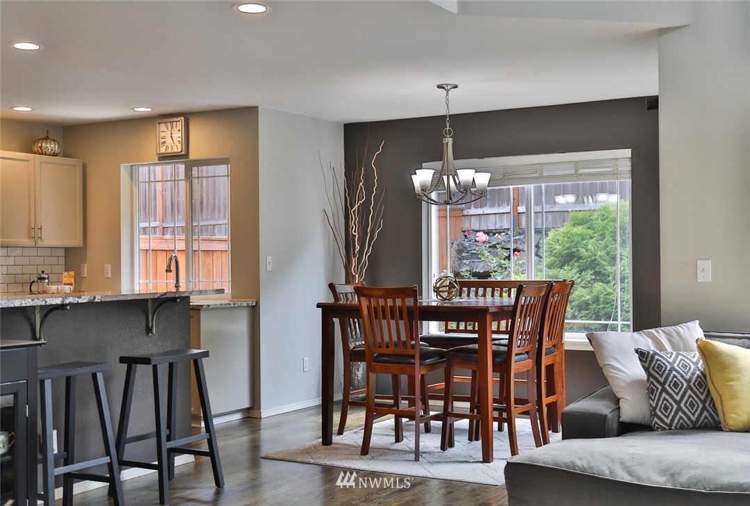 2432 195th Place Southeast, Unit B Bothell, WA 98012 - Photo 13 of 34 a view of a dining room with furniture window and outside view