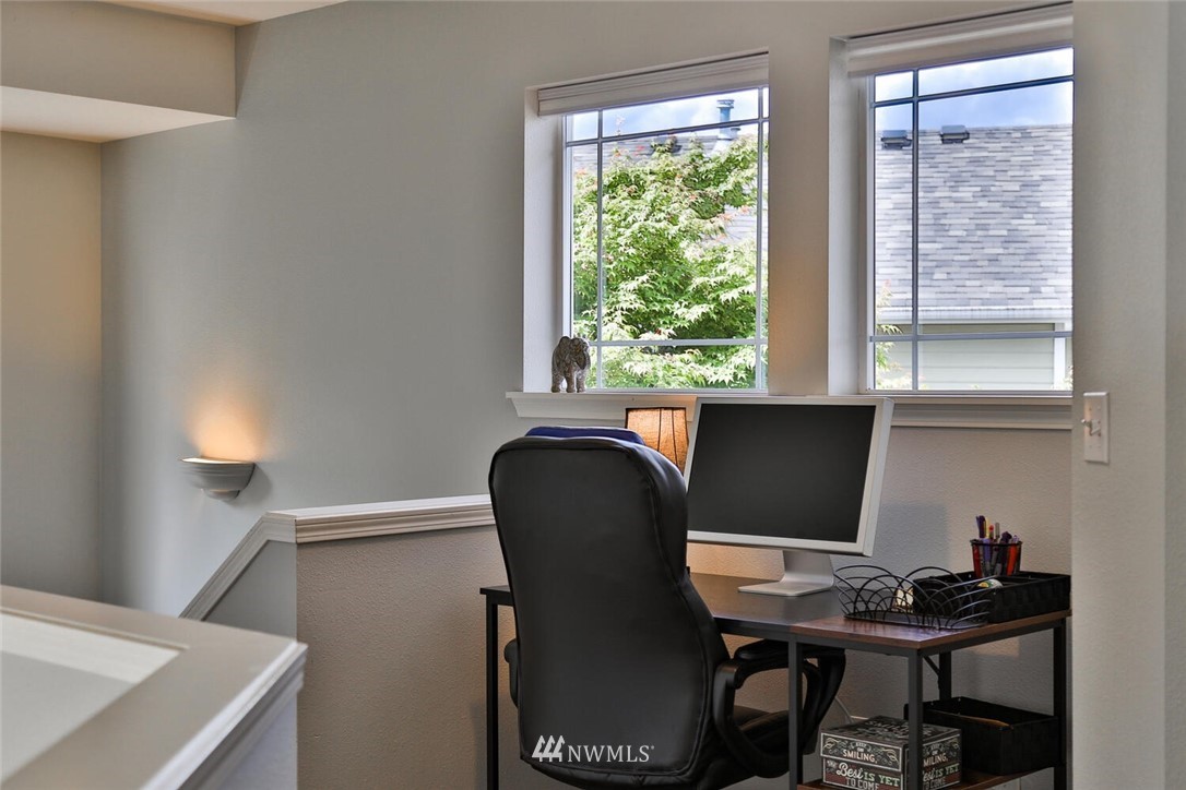 2432 195th Place Southeast, Unit B Bothell, WA 98012 - Photo 18 of 34 a view of a workspace with furniture and a window