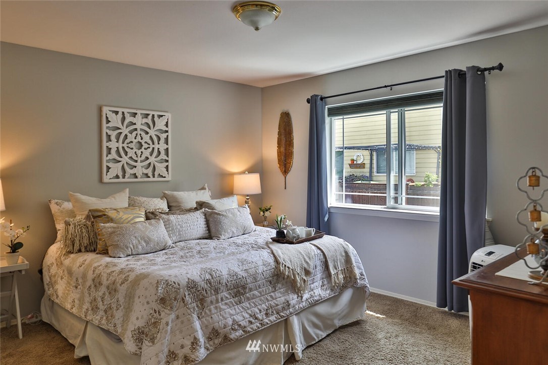 2432 195th Place Southeast, Unit B Bothell, WA 98012 - Photo 19 of 34 a bedroom with a bed and a window