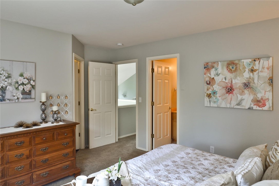 2432 195th Place Southeast, Unit B Bothell, WA 98012 - Photo 20 of 34 a bedroom with a bed and cabinets