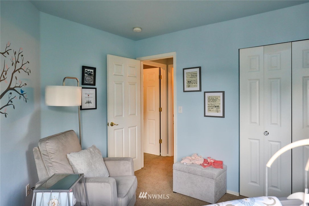 2432 195th Place Southeast, Unit B Bothell, WA 98012 - Photo 22 of 34 a living room with furniture and a couch