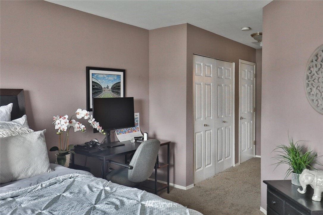2432 195th Place Southeast, Unit B Bothell, WA 98012 - Photo 24 of 34 a bedroom with bed furniture and wooden floor
