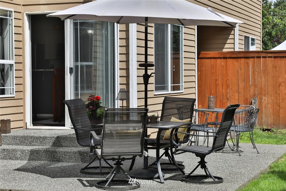 2432 195th Place Southeast, Unit B Bothell, WA 98012 - Photo 27 of 34 a view of a chairs and table in patio