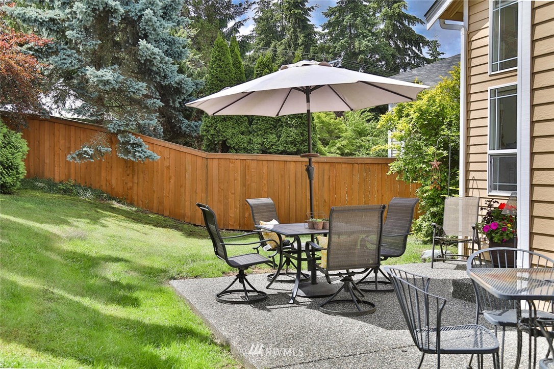 2432 195th Place Southeast, Unit B Bothell, WA 98012 - Photo 29 of 34 a view of backyard with seating space and trees