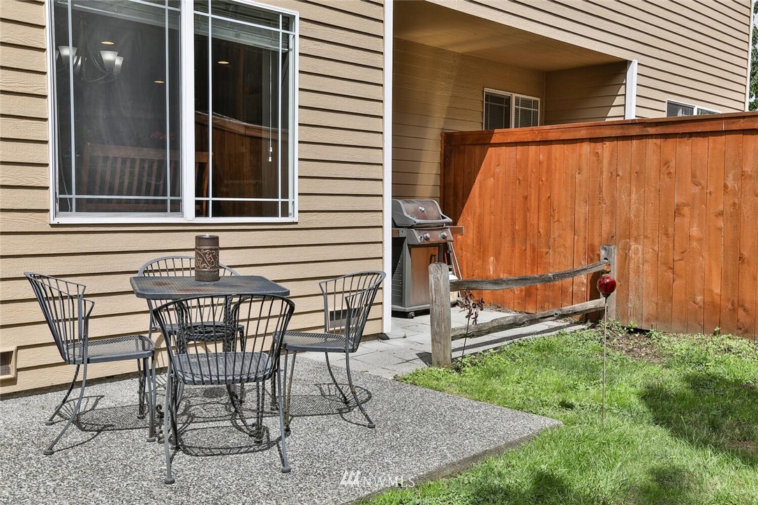 2432 195th Place Southeast, Unit B Bothell, WA 98012 - Photo 30 of 34 a view of a chair and table in backyard of the house