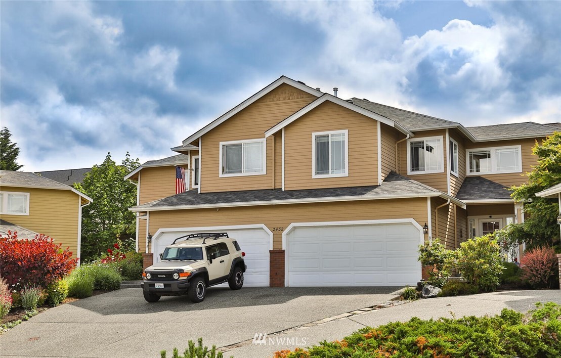 2432 195th Place Southeast, Unit B Bothell, WA 98012 - Photo 34 of 34 a car parked in front of a house