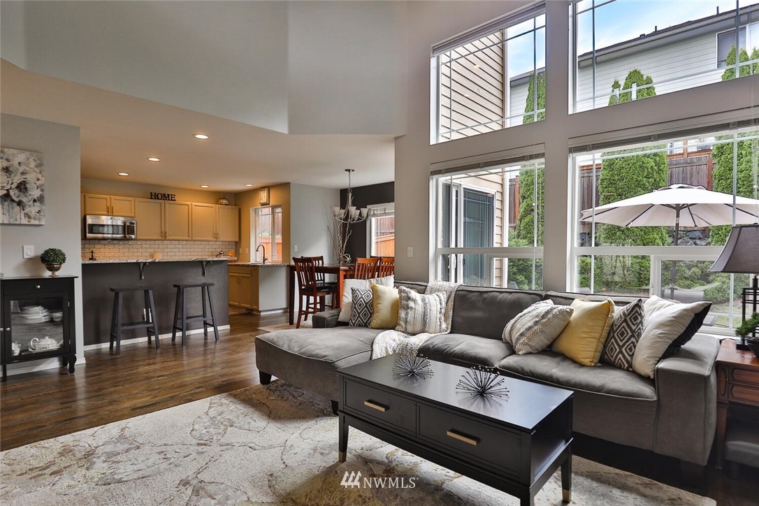 2432 195th Place Southeast, Unit B Bothell, WA 98012 - Photo 5 of 34 a living room with furniture and a large window
