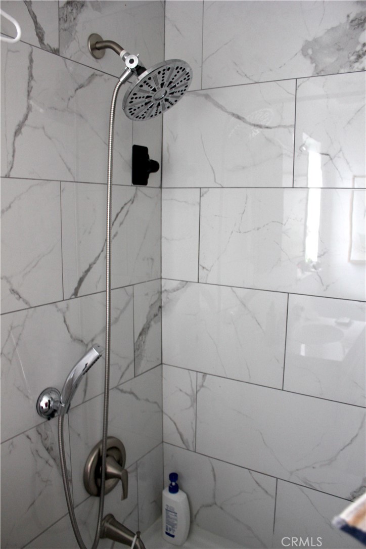 5911 Green Valley Road Riverside, CA 92504 - Photo 15 of 24 a bathroom with a shower