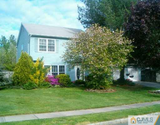 68 Higgins Road Old Bridge, NJ 08857 - Photo 1 of 5 a front view of a house with garden