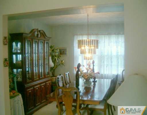 68 Higgins Road Old Bridge, NJ 08857 - Photo 4 of 5 a view of a dining room with furniture and window
