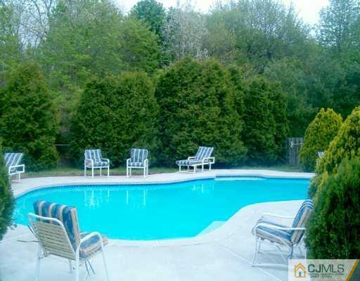 68 Higgins Road Old Bridge, NJ 08857 - Photo 5 of 5 a view of a swimming pool with a patio
