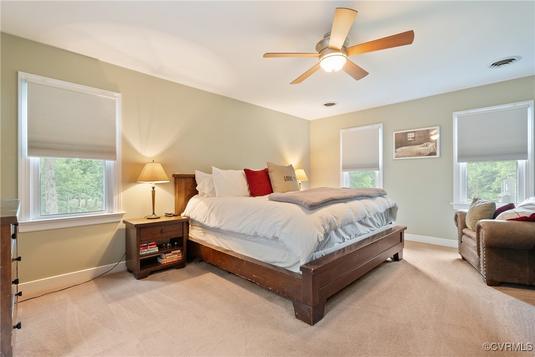 2501 Swanhurst Drive Midlothian, VA 23113 - Photo 21 of 44 a bedroom with a bed and a chandelier