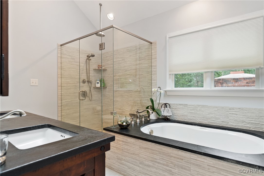 2501 Swanhurst Drive Midlothian, VA 23113 - Photo 23 of 44 a bathroom with a tub a sink and a shower