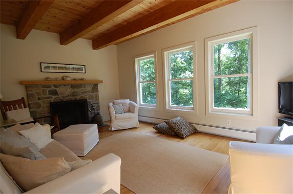 215 River Road Westport, MA 02790 - Photo 10 of 27 a living room with furniture and a fireplace