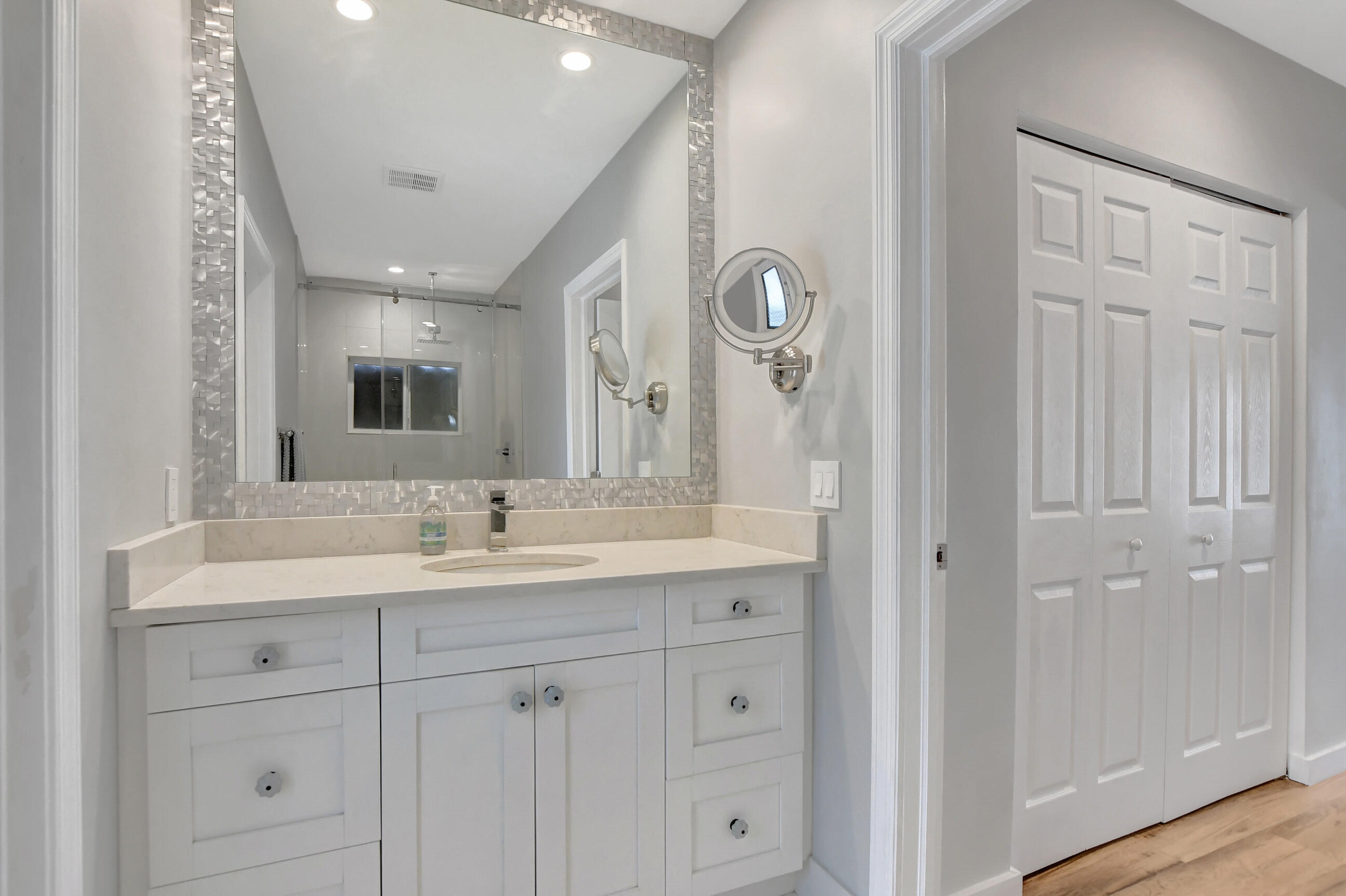 510 Silver Lane Boca Raton, FL 33432 - Photo 11 of 24 a bathroom with a double vanity sink and mirror