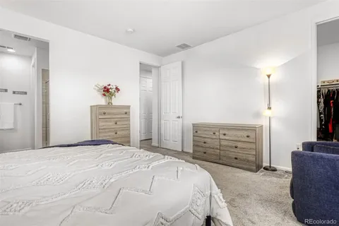 a bedroom with a bed and furniture