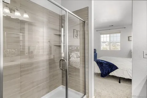 a spacious bathroom with a shower and a bathtub