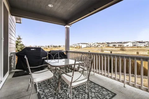 a view of a balcony with chairs