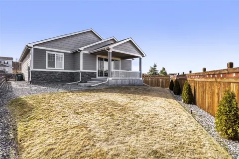 a front view of a house with yard