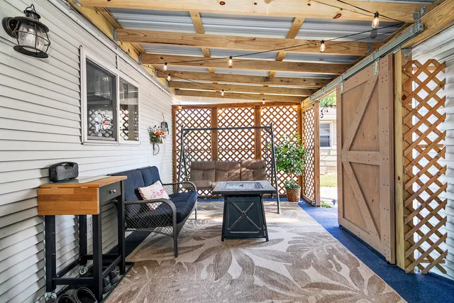a work room with furniture and wooden floor