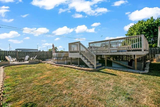 a view of a house with swimming pool and sitting area