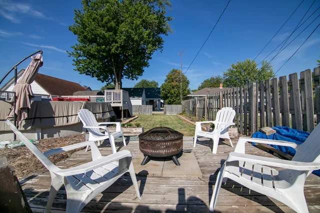 a view of a chairs and table in patio