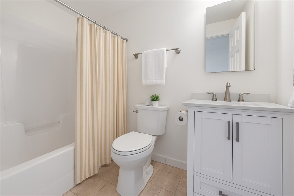 4 Charlesgate East, Unit 601 Boston, MA 02215 - Photo 16 of 33 a white toilet sitting next to a bathroom sink