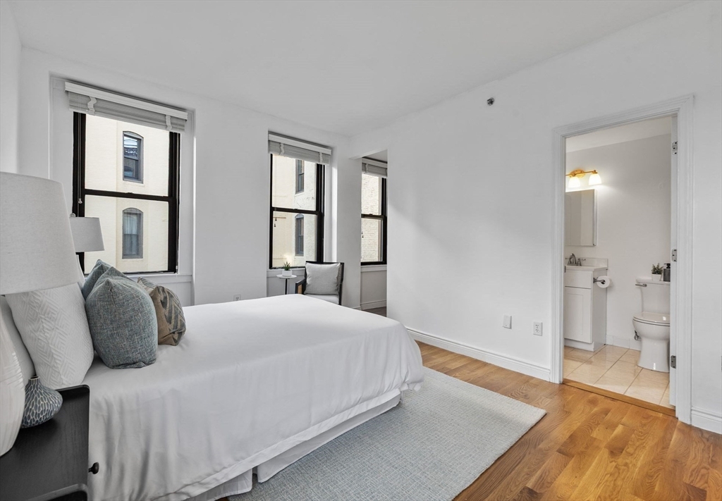 4 Charlesgate East, Unit 601 Boston, MA 02215 - Photo 18 of 33 a bedroom with a bed and a view of bathroom