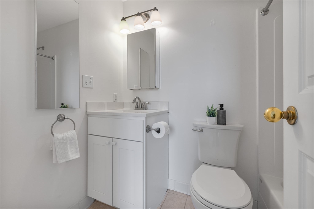 4 Charlesgate East, Unit 601 Boston, MA 02215 - Photo 22 of 33 a white toilet sitting next to a bathroom sink