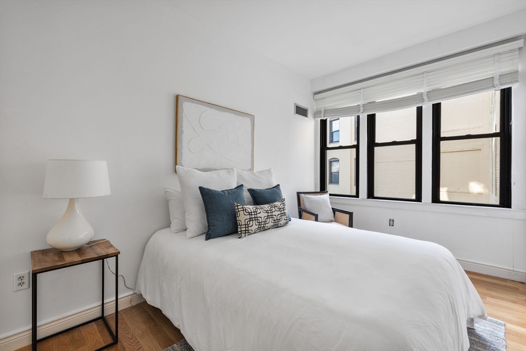 4 Charlesgate East, Unit 601 Boston, MA 02215 - Photo 23 of 33 a bedroom with a bed and a window