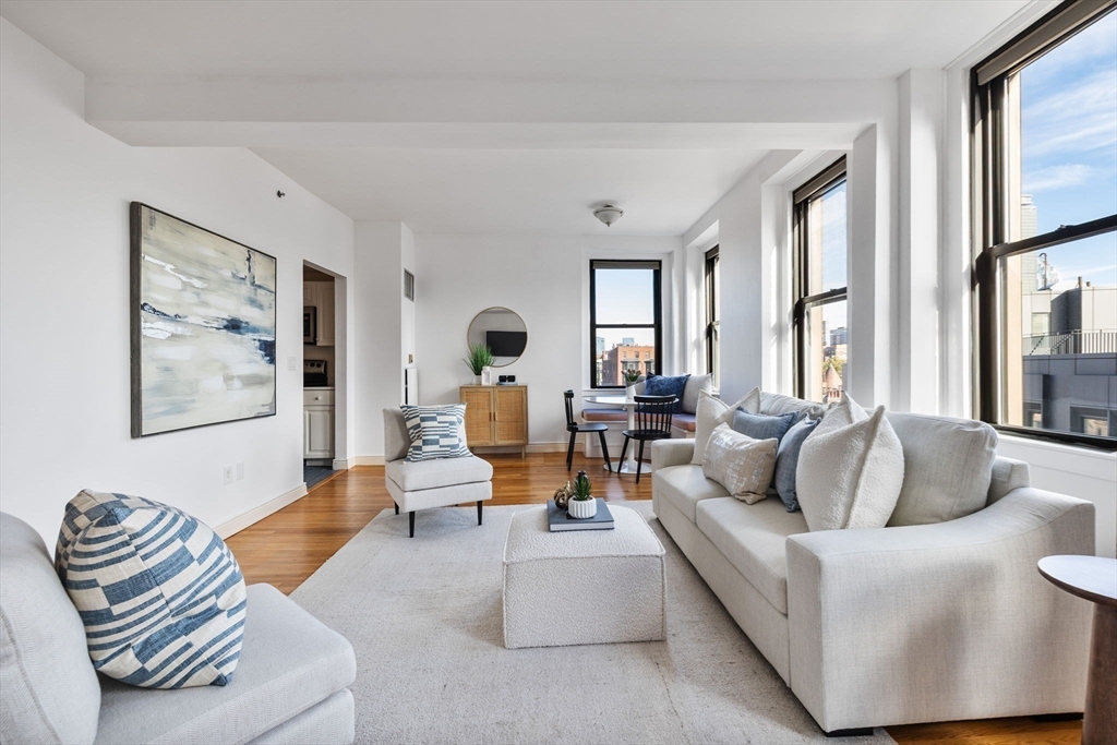 4 Charlesgate East, Unit 601 Boston, MA 02215 - Photo 6 of 33 a living room with furniture and large windows