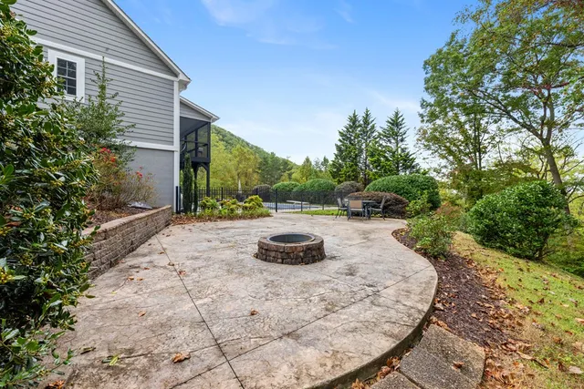 a living room with furniture a piano and a window