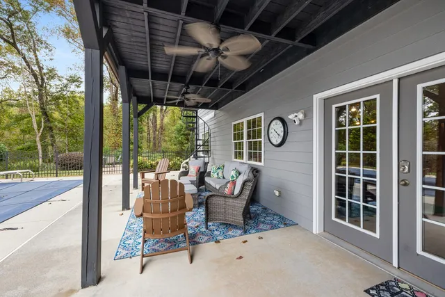 a kitchen with stainless steel appliances granite countertop a stove top oven a sink dishwasher a refrigerator and cabinets with wooden floor