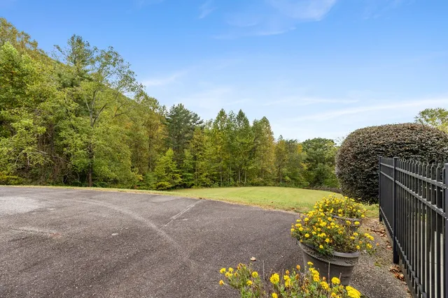a dining room with furniture a chandelier and wooden floor