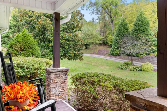a view of a room that has a table and chairs in it