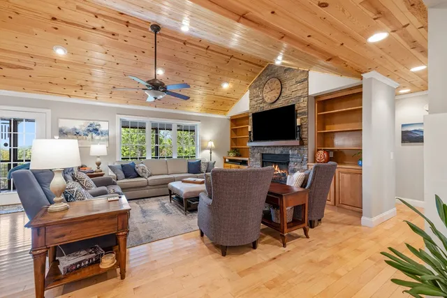 a view of walk in closet with clothes