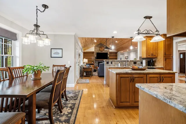 a bathroom with a toilet a sink a vanity and mirror