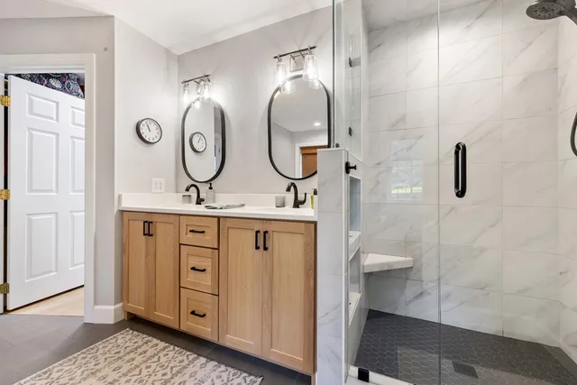 an aerial view of a house with swimming pool and garden