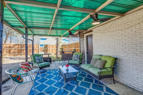 a outdoor living space with furniture and garden