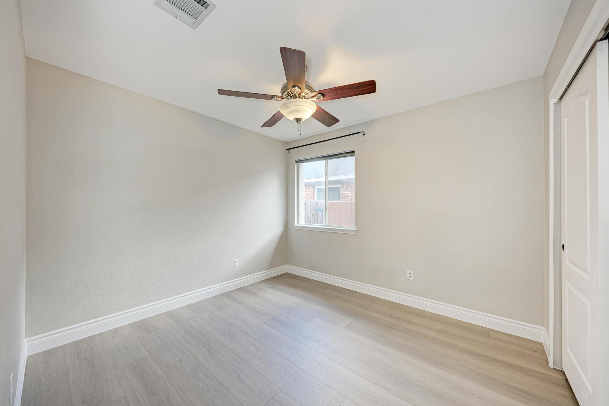 4408 Tello Path Austin, TX 78749 - Photo 28 of 38 Unfurnished bedroom featuring a closet, light wood-style flooring, and ceiling fan
