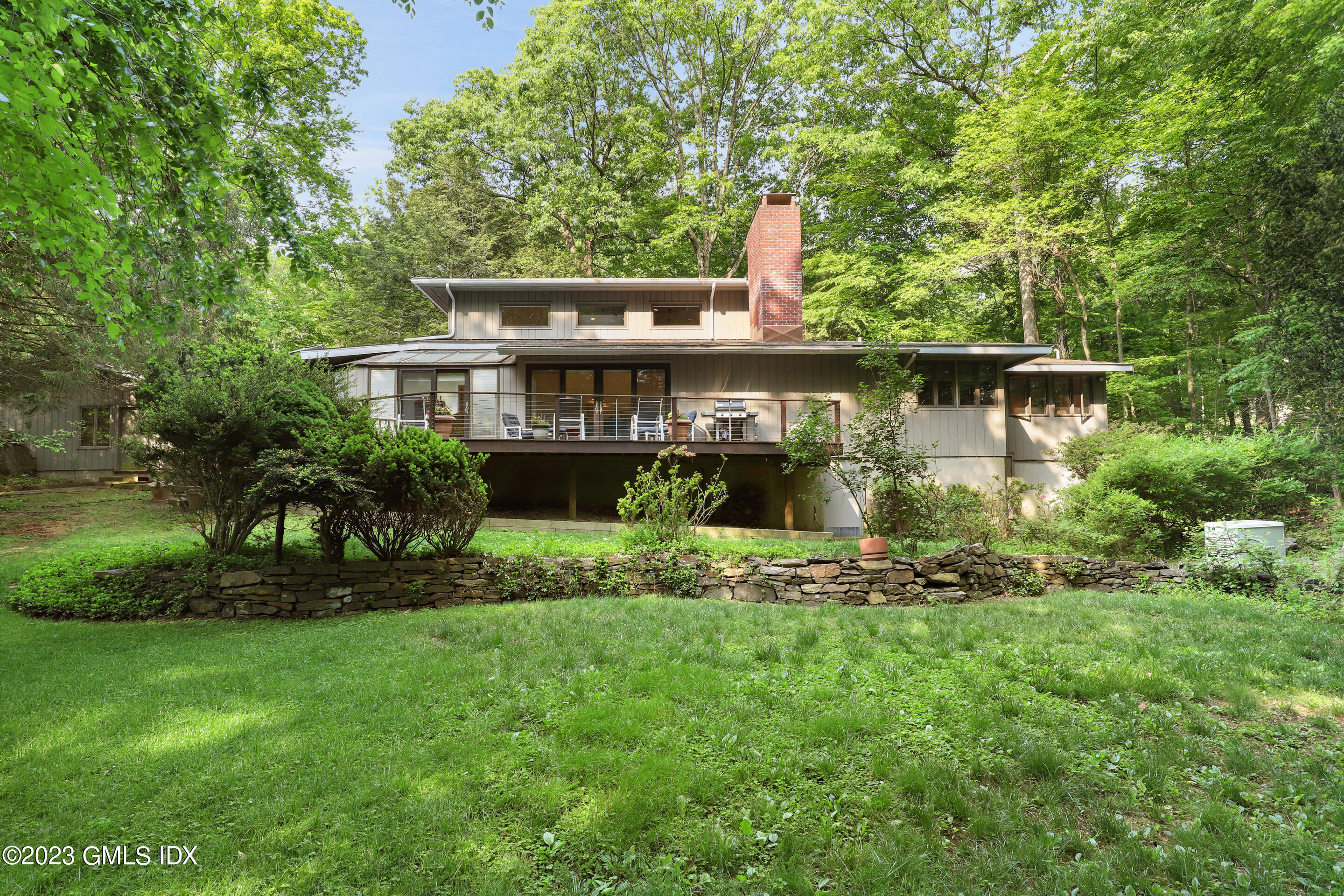 31 Ferncliff Road Cos Cob, CT 06807 - Photo 1 of 28 a front view of a house with a garden