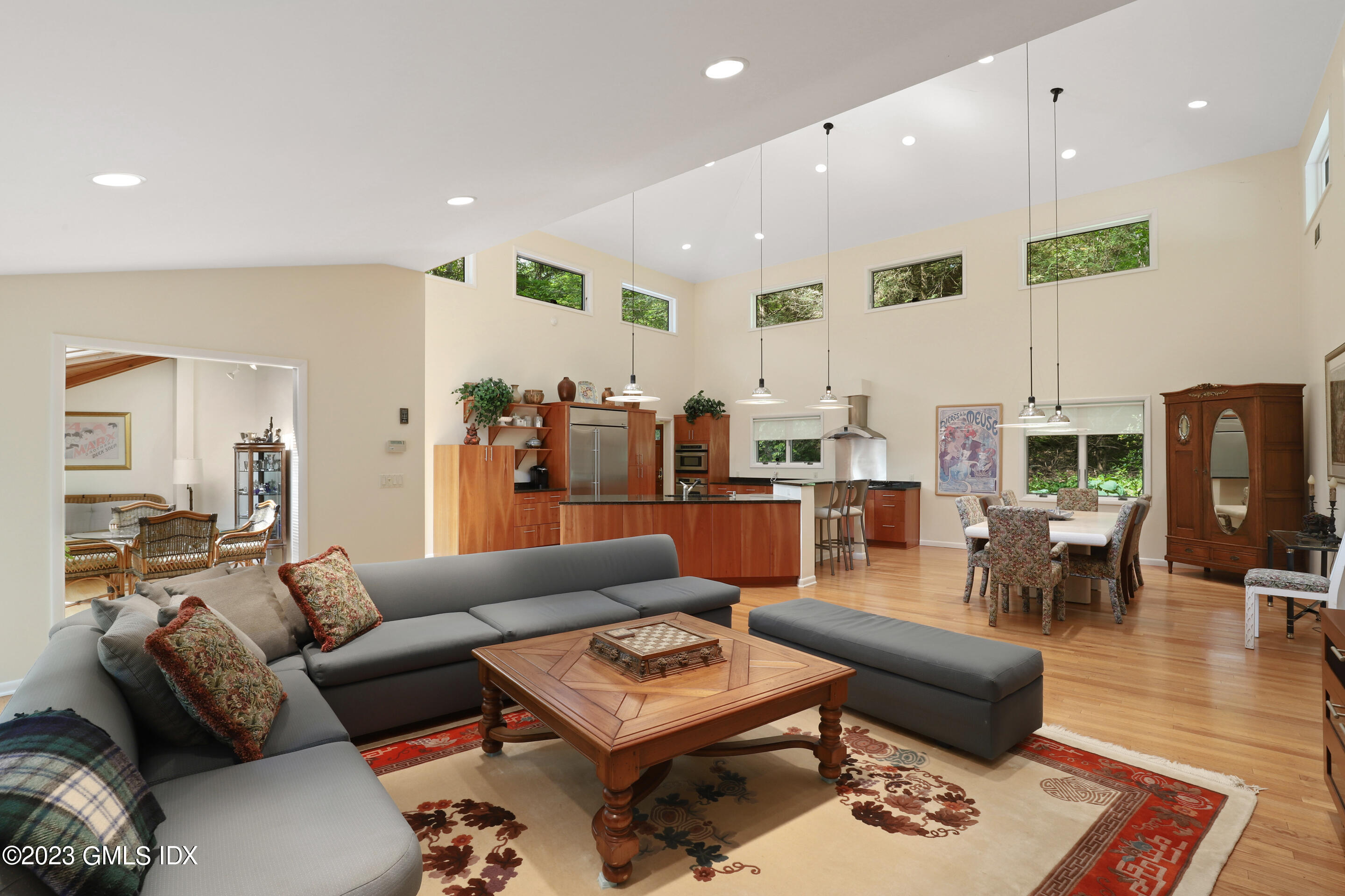 31 Ferncliff Road Cos Cob, CT 06807 - Photo 5 of 28 a living room with furniture kitchen view and a flat screen tv