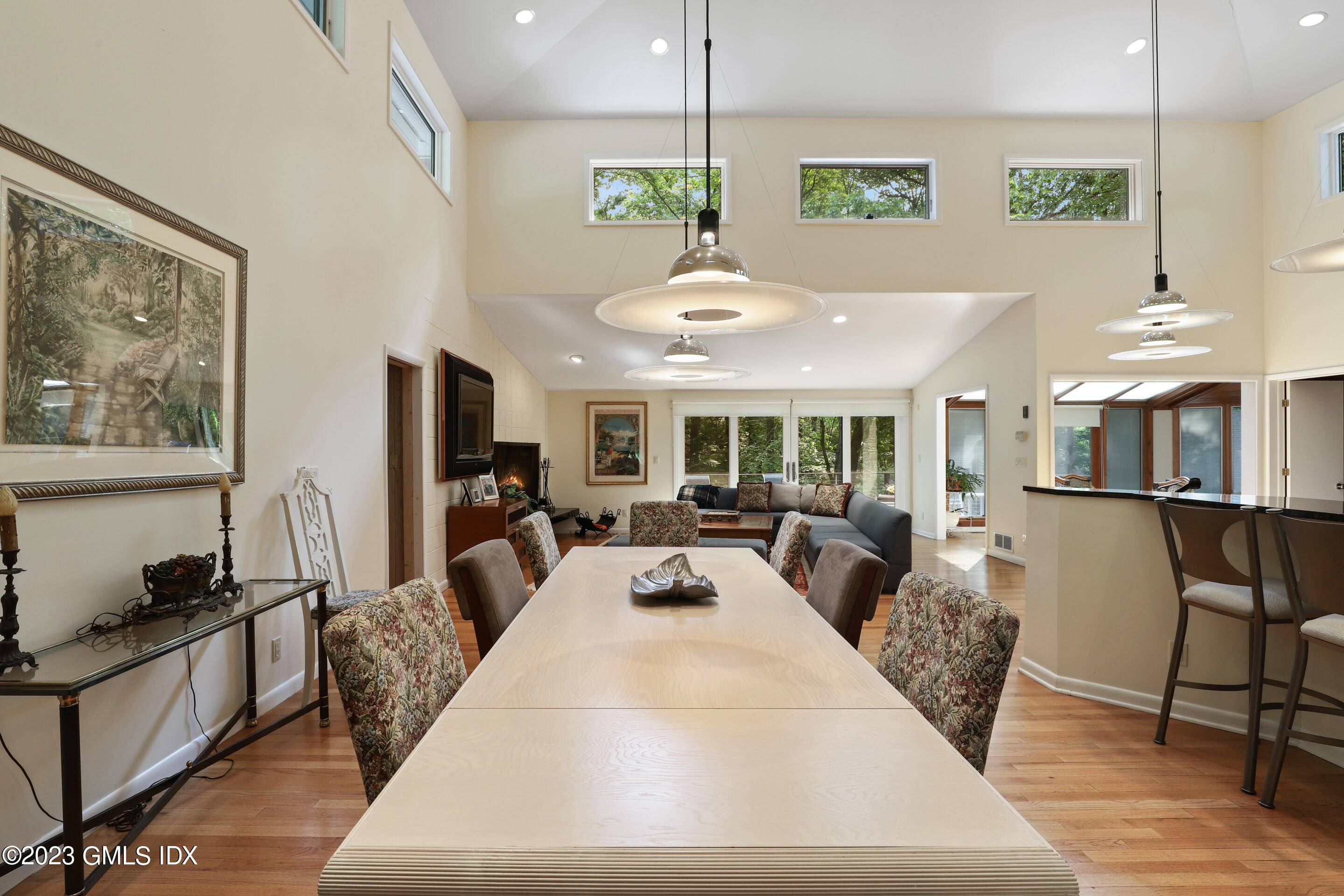 31 Ferncliff Road Cos Cob, CT 06807 - Photo 10 of 28 a view of a dining room with furniture a chandelier and wooden floor